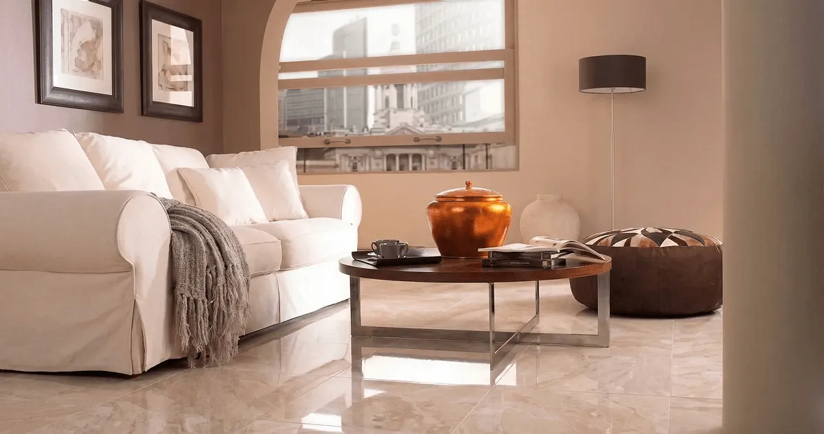 Modern living room with professionally installed marble flooring, a beige sofa, coffee table in Hialeah, FL