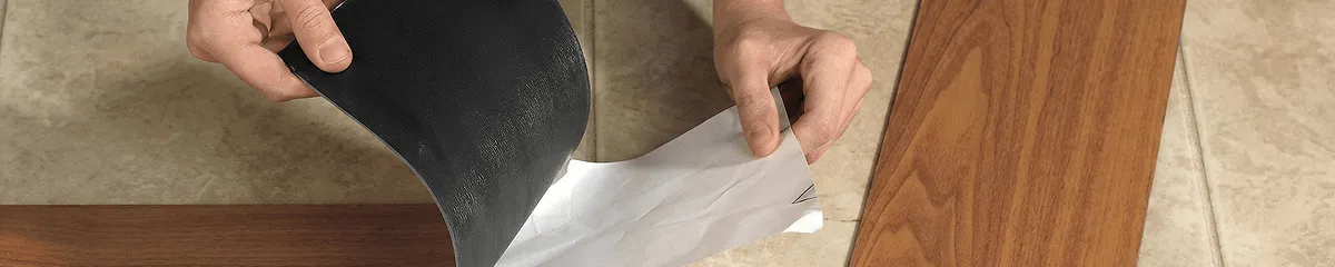 A professional installing vinyl flooring in Hialeah, FL
